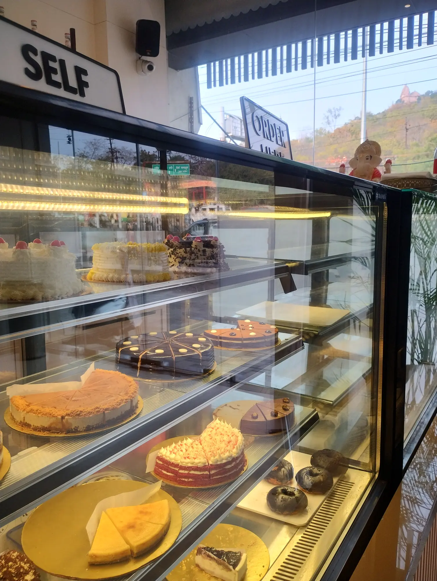 Bakery display with cakes and pastries