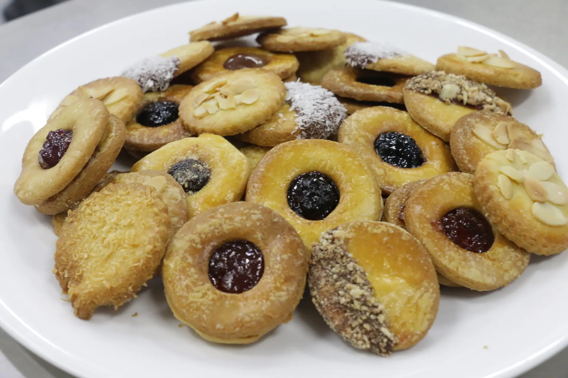 Plate of assorted jam and nut cookies