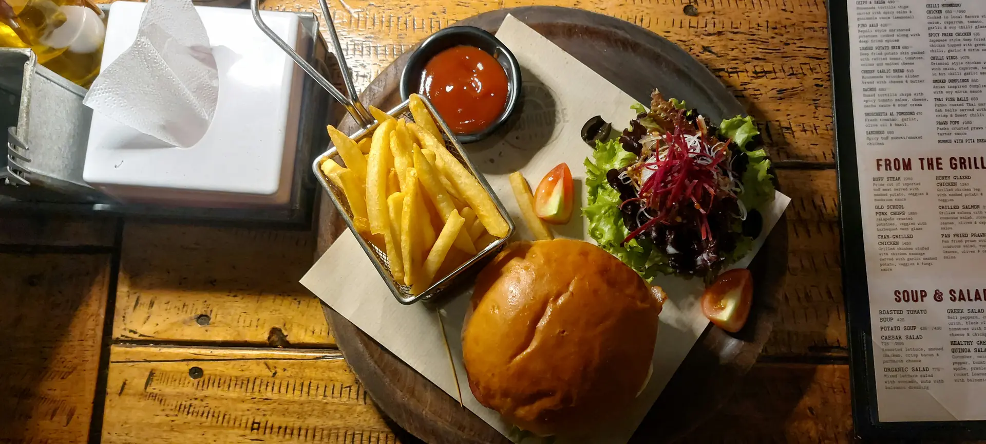 Burger served with fries and salad